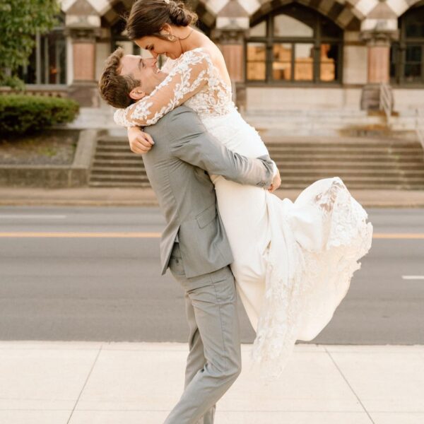 groom lifting bride