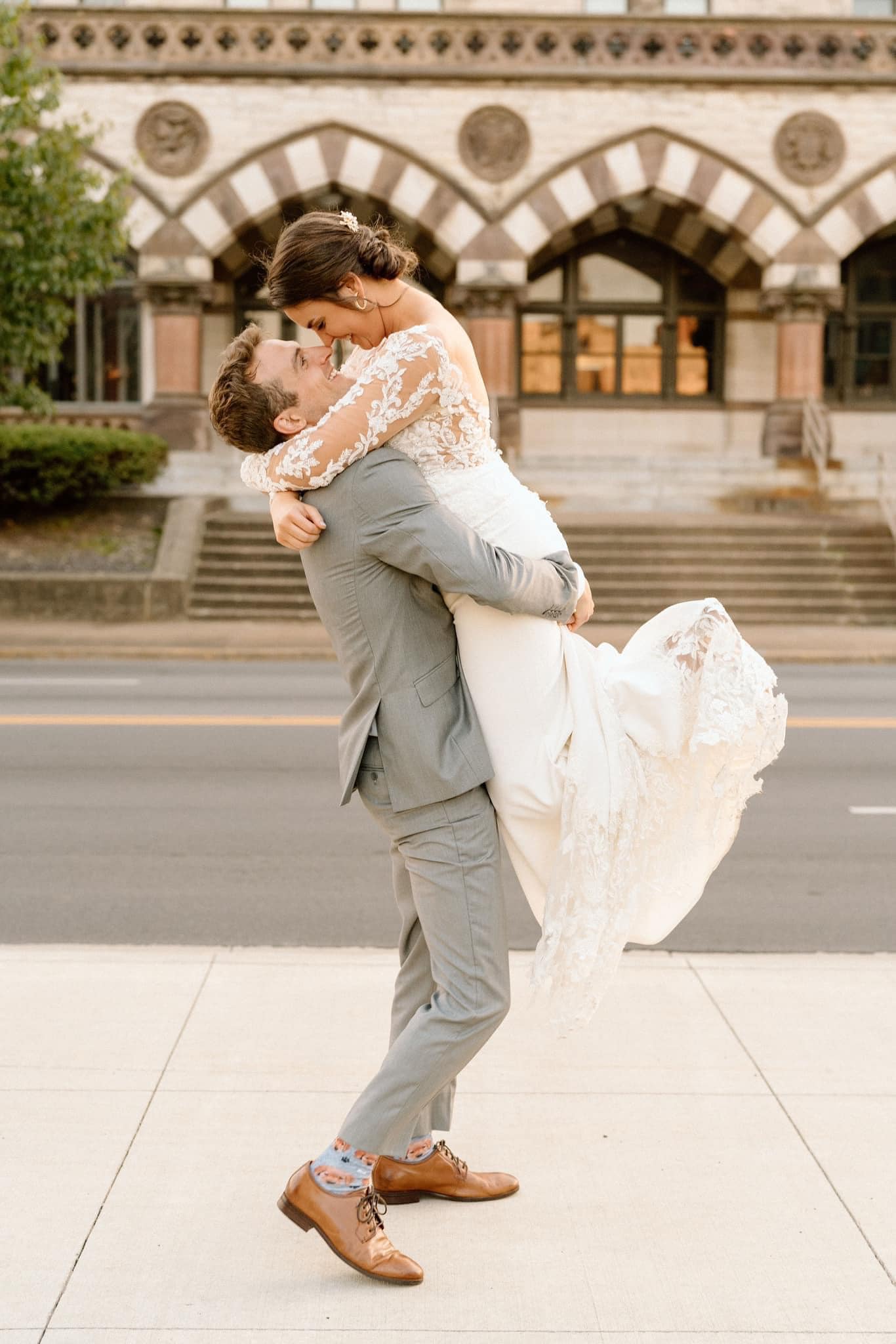 groom lifting bride