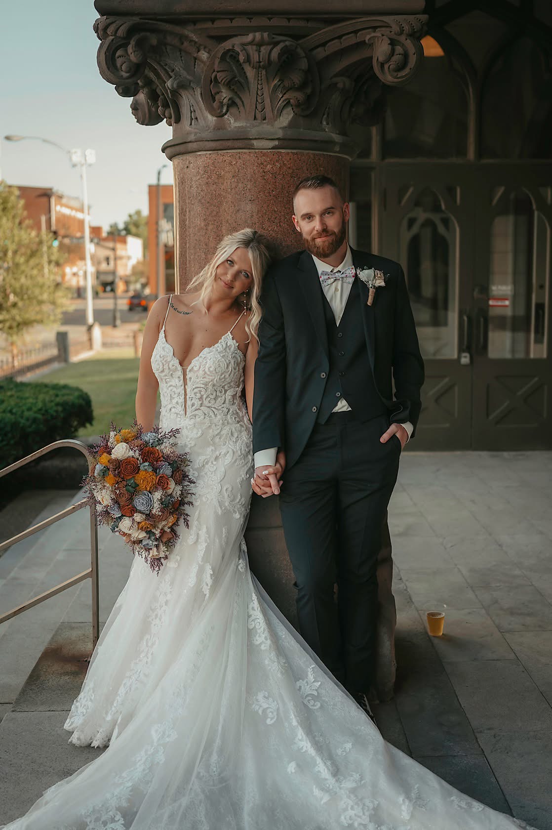 bride and groom holding hands